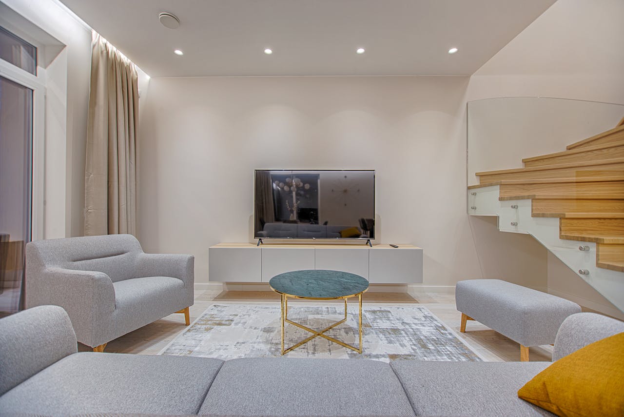 services-02 Stylish minimalist living room with modern furniture and warm lighting.